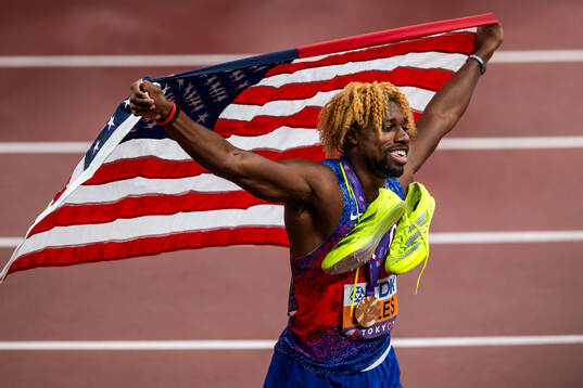 Noah Lyles of USA celebrates