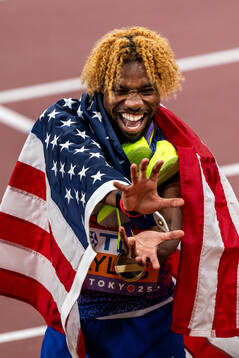Noah Lyles of USA celebrates