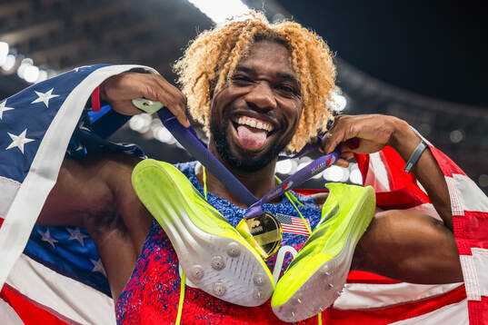 Noah Lyles of USA celebrates