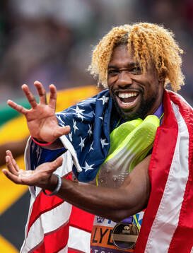 Noah Lyles of USA celebrates