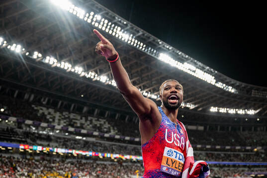 Noah Lyles of USA celebrates