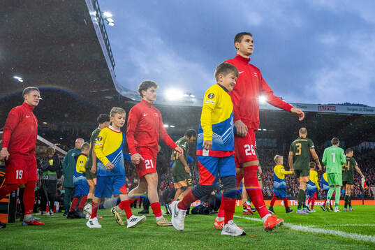 Eivind Helland of Brann enters the pitch