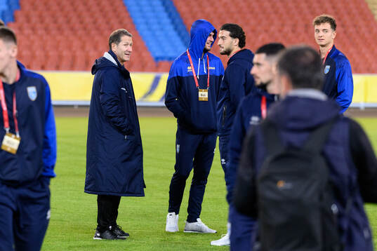Head coach Franco Foda and Fisnik Asllani of Kosovo