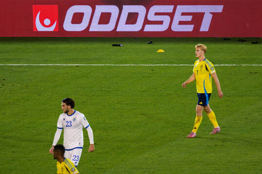 An add for Svenska Spels Oddset is seen behind Lucas