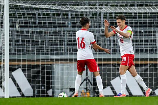 Tomasz Pienko of Poland celebrate with Kacper Urbanski