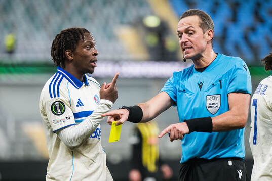 Martial Godo of Strasbourg receives a yellow card från