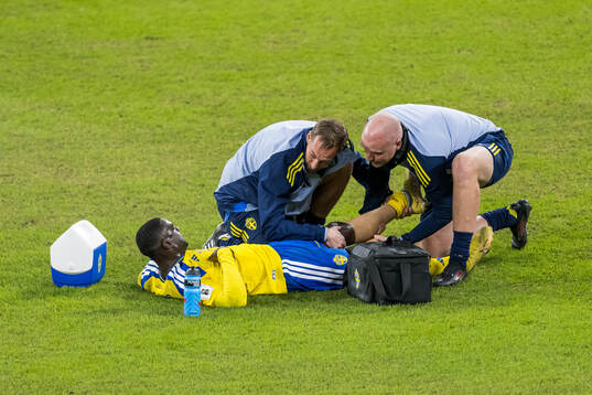 Ken Sema of Sweden receives medical attention