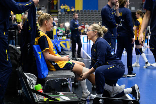Nathalie Hagman of Sweden receives medical attention