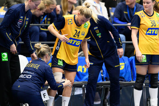 Nathalie Hagman of Sweden receives medical attention