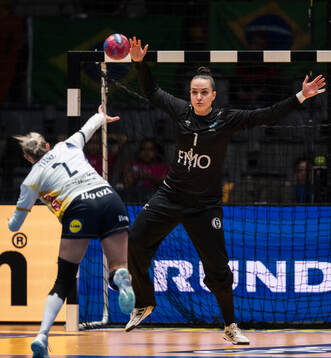 Clara Lerby of Sweden and Goalkeeper Gabriela Moreschi of