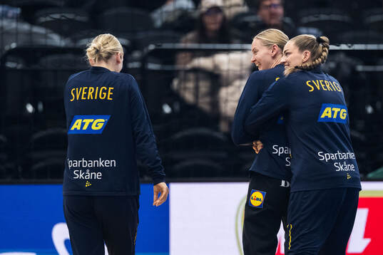 Emma Lindqvist and Goalkeeper Johanna Bundsen of Sweden
