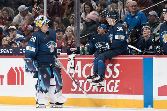 Goaltender Petteri Rimpinen and Arttu Välilä of Finland