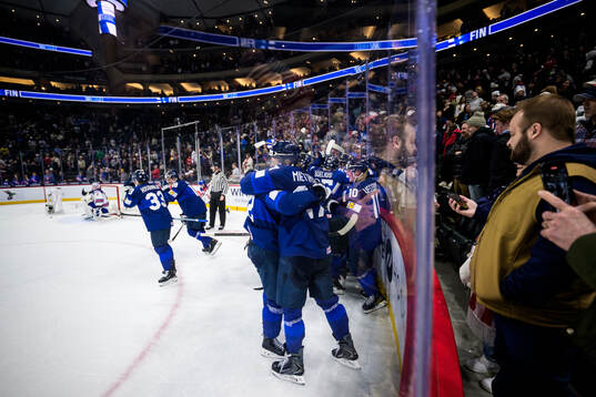 Emil Hemming and Julius Miettinen of Finland hug each other
