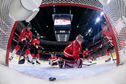 Goaltender Jack Ivankovic of Canada lets in the 4-5 goal by