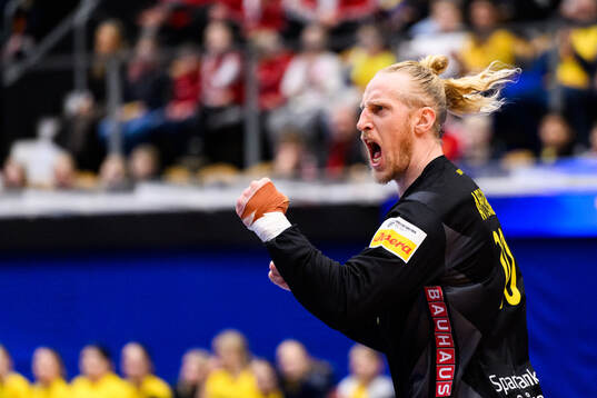 Goalkeeper Mikael Apelgren of Sweden celebrates