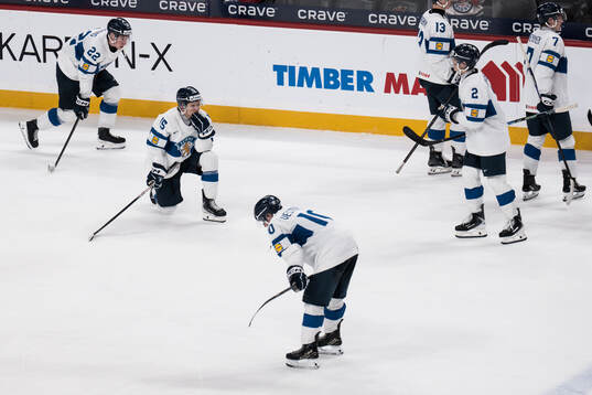 Aatos Koivu and Roope Vesterinen of Finland looks dejected