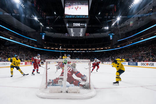 Victor Eklund of Sweden scores the 2-0 goal behind