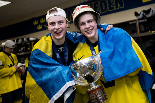 Goaltender Love Härenstam and Ivar Stenberg of Sweden