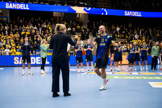 Lukas Sandell of Sweden receives an award for player of the