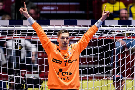 Goalkeeper Dominik Kuzmanovic of Croatia celebrates