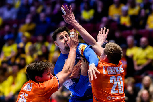 Zvonimir Srna of Croatia against Lars Kooij and Niels