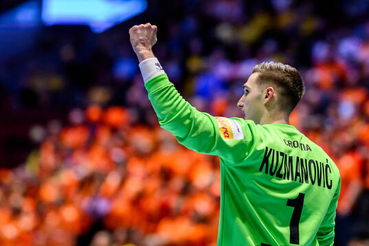Goalkeeper Dominik Kuzmanovic of Croatia celebrates
