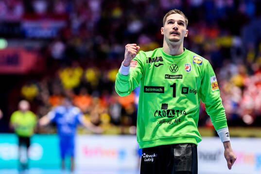 Goalkeeper Dominik Kuzmanovic of Croatia celebrates