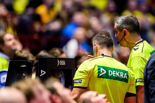 The referee does a video review of a potential goal