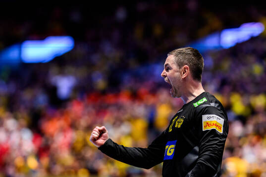 Goalkeeper Andreas Palicka of Sweden celebrates