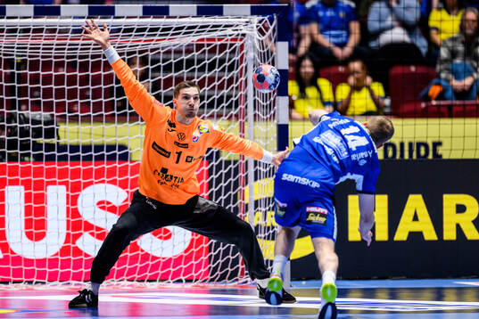 Goalkeeper Dominik Kuzmanovic of Croatia and Omar Ingi