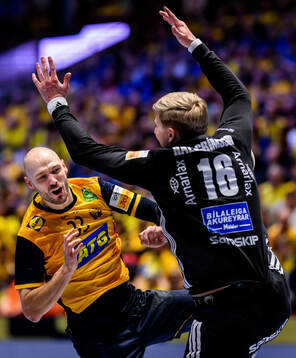 Lukas Sandell of Sweden and goalkeeper Viktor Hallgrimsson