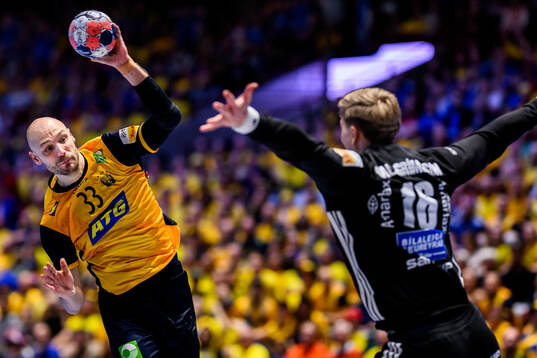 Lukas Sandell of Sweden and goalkeeper Viktor Hallgrimsson