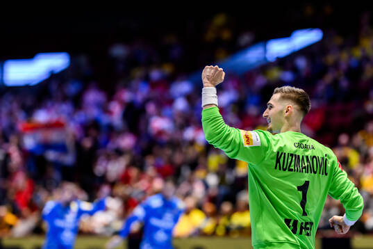 Goalkeeper Dominik Kuzmanovic of Croatia celebrates