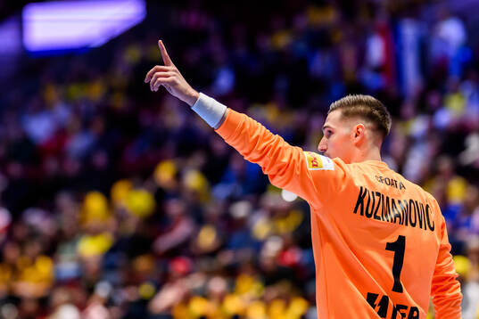 Goalkeeper Dominik Kuzmanovic of Croatia celebrates