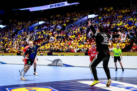 Daniel Pettersson of Sweden and goalkeeper Kristof Laszlo