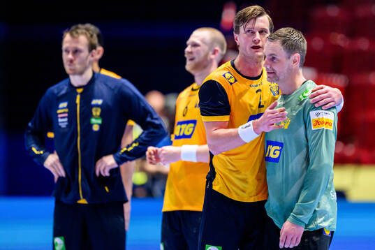 Jonathan Carlsbogård and goalkeeper Andreas Palicka of