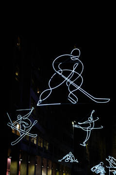 Lights in the shape of athletes in freestyle skiing, ice