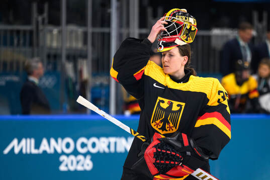 Goaltender Sandra Abstreiter of Germany looks dejected in