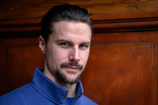 Erik Karlsson poses for a portrait at a press conference