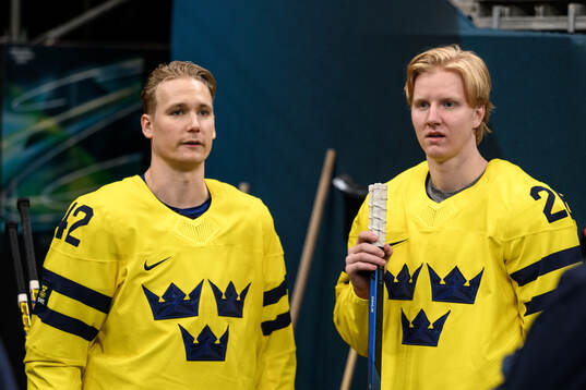 Gustav Forsling and Rasmus Dahlin of Sweden at an ice