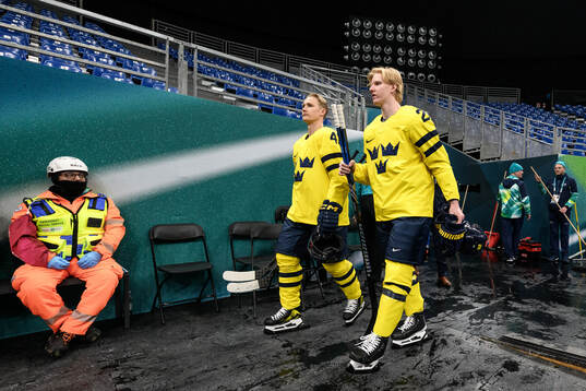 Gustav Forsling and Rasmus Dahlin of Sweden at an ice