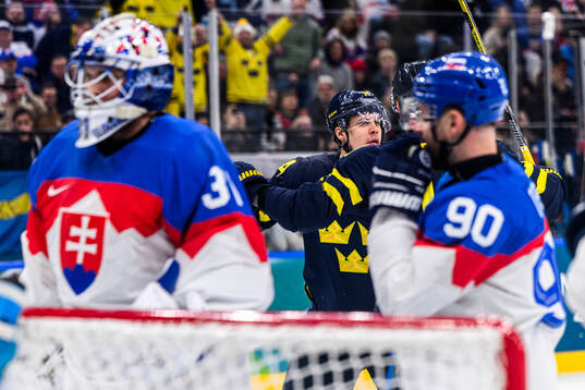 Joel Eriksson Ek of Sweden celebrates 1-0 in the men's ice