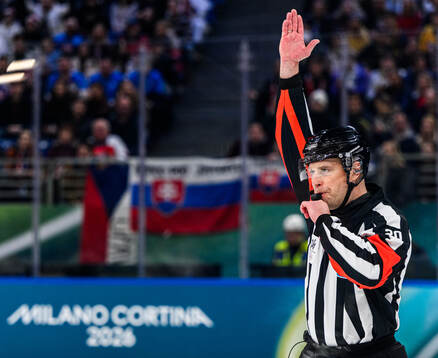 Referee Andris Ansons in the men's ice hockey game between