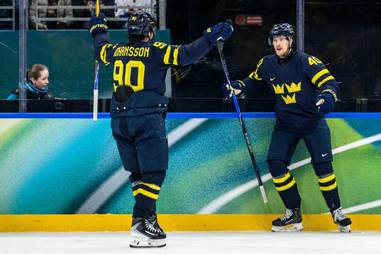 Elias Pettersson of Sweden celebrates 3-2 in the men's ice