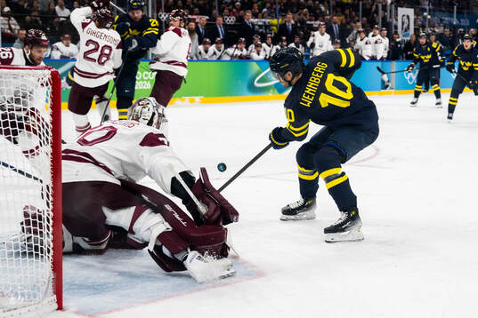 Goaltender Elvis Merzlikins of Latvia and Alexander
