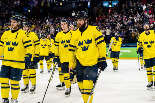 Elias Lindholm and William Nylander of Sweden look dejected