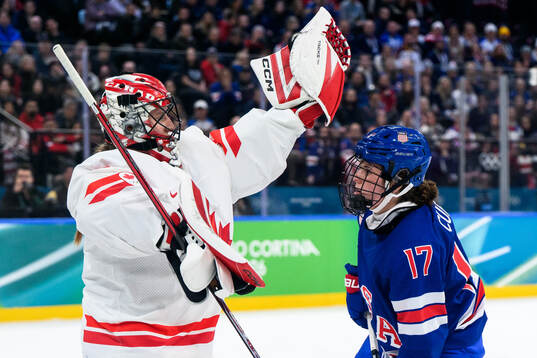 goaltender Ann-Renee Desbiens of Canada and Britta Curl of
