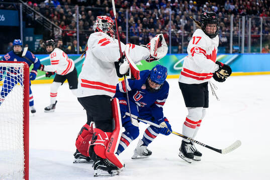 goaltender Ann-Renee Desbiens of Canada and Britta Curl of