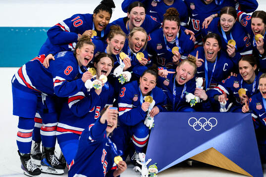 Team USA celebrate with their gold medals