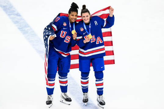 Laila Edwards and Megan Keller of USA celebrate with their